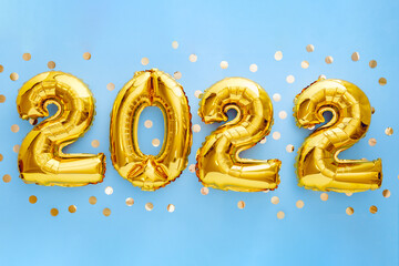 2022 Happy New year eve invitation with Christmas gold foil balloons calendar. 2022 numeral balloon gold text on Blue background with golden confetti for New year celebration