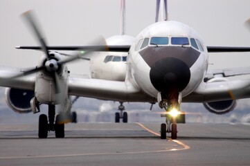Fototapeta na wymiar Japanese old propeller airliner YS-11 taxing to runway