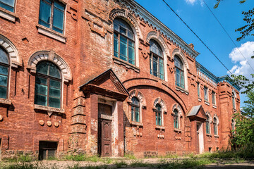 Fototapeta na wymiar Old brick abandoned school for boys