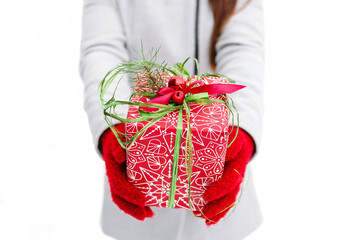 winter holidays, christmas and people concept - close up Hands of woman holding christmas gift box.
