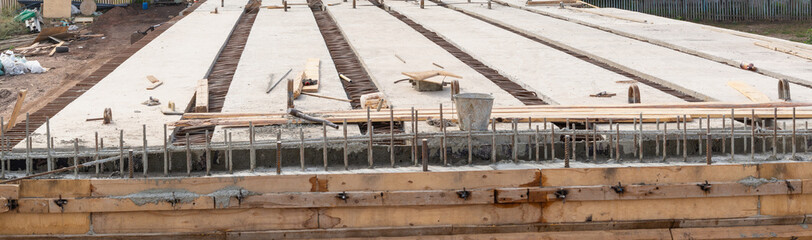 Construction of a new bridge made of concrete slabs.