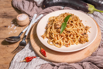 Traditional Sicilian pasta dish of sauteed eggplant topped with tomato sauce