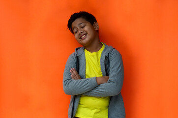 Handsome Indonesian students with enthusiastic expressions go to school