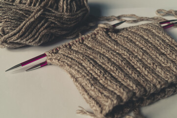 Knitting on sheep yarn needles.