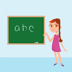 Cute female teacher pointing blackboard