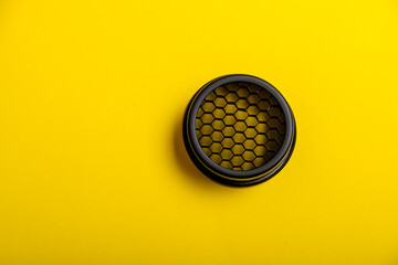 a cellular flash attachment on a yellow background.photo equipment.