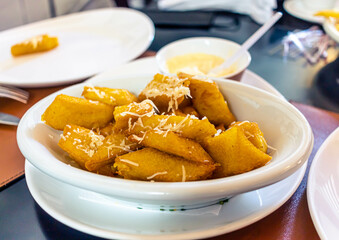 fried polenta with cheese, typical brazilian food on the table