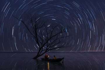 Star trails movement at night in Thailand.fisherman,fishing