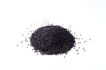 Pile of black sesame seeds on white background