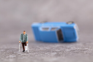 Injured leg after car accident in miniature scene