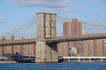 One of the towers of the famous old and historic Brooklyn Bridge spanning the East River from...