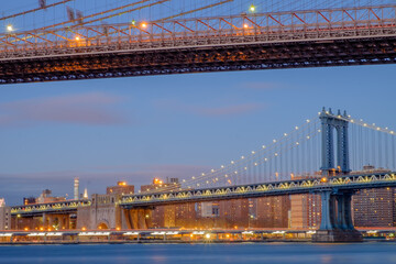 The Brooklyn Bridge and the Manhattan bridge spanning the East River from Brooklyn into Lower Manhattan and the financial district of New York City