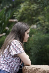 Naklejka premium Beautiful girl with natural trees and leaf in the background