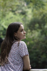 Beautiful girl with natural trees and leaf in the background