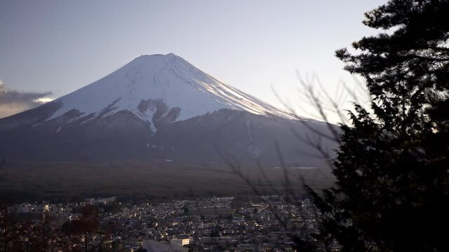 Beautiful Mt. Fuji with snow cover on the top viewed from behind Chureito Pagoda, landmark travel place. Winter seasons japanese landscape. Japan tallest mountain is a popular foreign tourists.-Dan