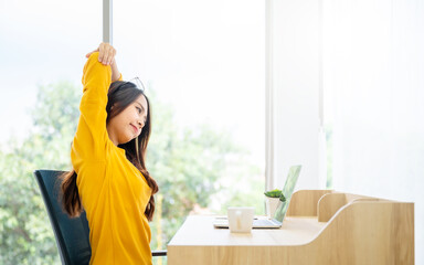 Office syndrome concept. Young asian woman feeling pain in neck and shoulder after working on...
