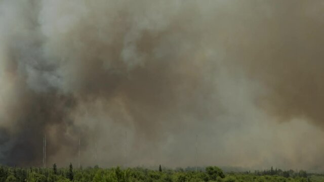 Big fire at Varimbombi, Athens, Greece, August 03, 2021. Ericsson helicopter flying over huge black smoke from raging fire 120fps