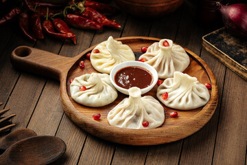 Georgian khinkali dumplings stuffed with meat with sauce
