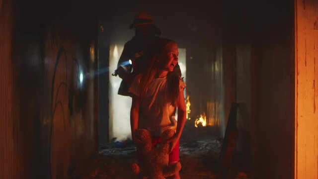 Firemen saving girl in burning building