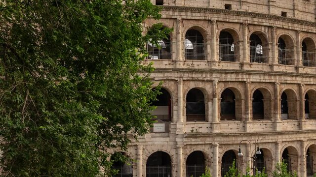 hyperlapse of the side of Colosseum in Rome. Amazing architecture central details from the left side of this big oval amphitheatre in the centre of the city of Rome, Italy. Colosseo, Roma