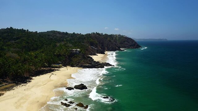 Aerial View Of The Rocky Cliffs On The Sandy Beach In San Pancho, Mexico.  