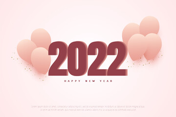 Happy new year 2022 on pink balloon background.