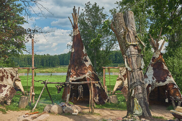 layout of the parking lot of ancient people, wigwams, bonfire, animal skins, totem pole © Alex