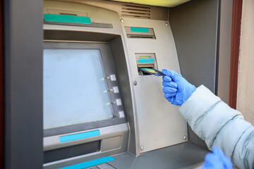 Woman withdrawing money from ATM
