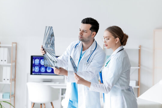 Doctors with x-ray scans in clinic