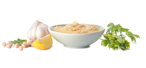 Bowl with tasty hummus and ingredients on white background