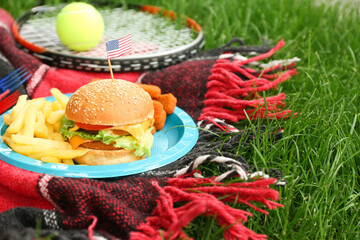 Traditional American food on plaid in park