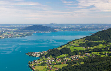 Fototapeta na wymiar Attersee with Austria Alps and city Seefeld from lookout on hill Schoberstein