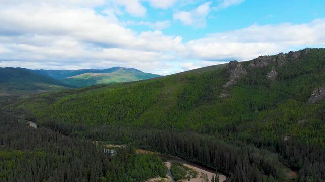 4K Drone Video of Mountains above Chena River near Chena Hot Springs, Alaska (pan right, high elevation)