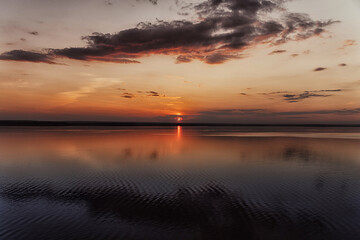 Obraz premium Amazing landscape at sunset. Colorful sunrise on the ocean or sea beach. Colorful nature sea sky