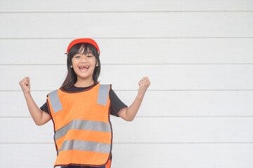 Asian girl children playing as an engineer helmet