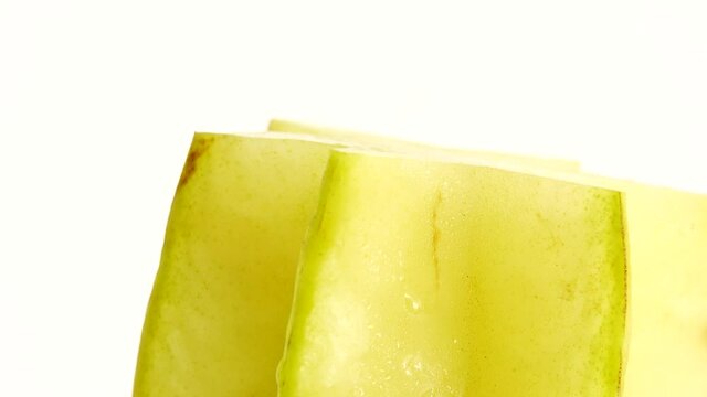 4K Organic star fruit carambola or star apple ( starfruit ) close-up rotates on a white background