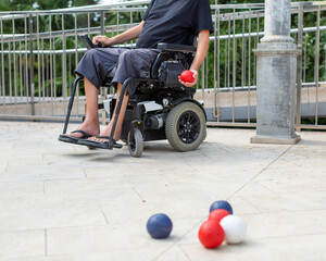 Disabled Boccia player playing on a wheelchair