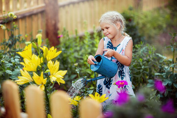 a girl waters flowers, a lily, a garden, a young florist, summer in the village, joy, happiness,...