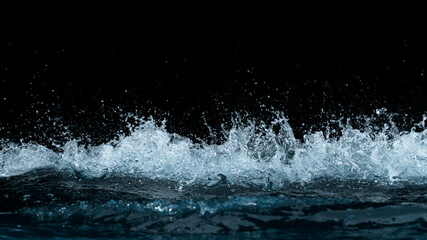 Fototapeta na wymiar Freeze motion of water splash isolated on black background.