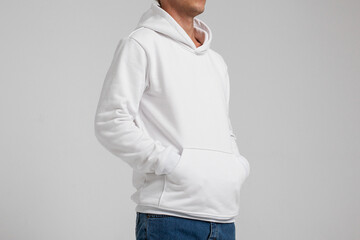 Young male in blank white hoodie front view. Design men  sweatshirt with pocket template and...