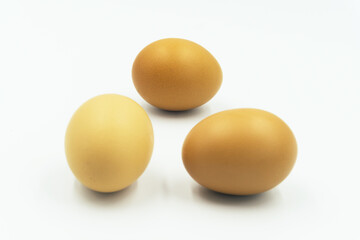 Chicken eggs in carton box on white background.