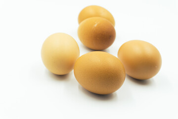 Chicken eggs in carton box on white background.