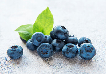 Blueberries on grey concrete background