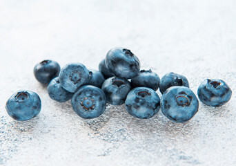 Blueberries on grey concrete background