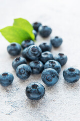 Blueberries on grey concrete background