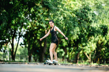 middle-aged Beautiful Sport Asian woman surf skate or skates board outdoors on beautiful summer day. © mnirat