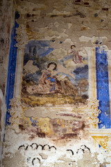 illustrations from the bible on the wall of an abandoned temple