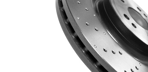 Car brake disc isolated on white background. Auto spare parts. Perforated brake disc rotor isolated...