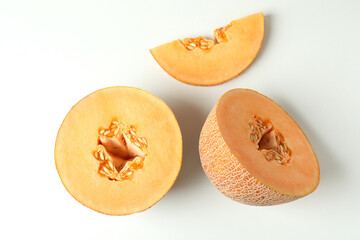 Ripe melon slices on white background, top view