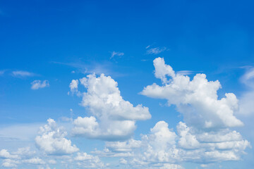 Naklejka na ściany i meble Many white clouds in the blue sky